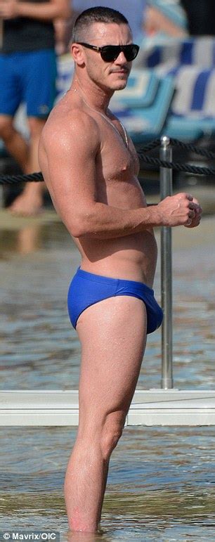 Shirtless Luke Evans Hits The Beach With Male Companion In Mykonos