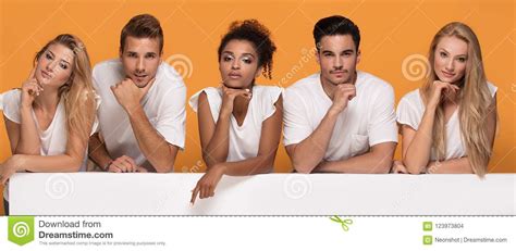 people posing  white empty board stock photo image  group friendship