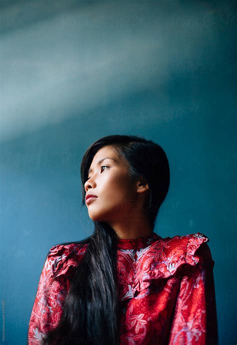 Portrait Of Asian Woman In Red Dress By Stocksy Contributor Marko
