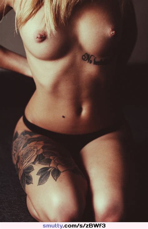 tattoo tattooed blonde topless tits boobs pierced nipples