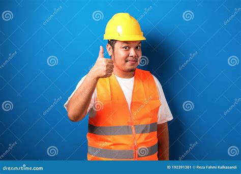 Fat Asian Construction Worker Wearing Orange Safety Vest And Helmet