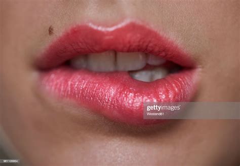 Closeup Of Woman Biting On Her Lip Photo Getty Images