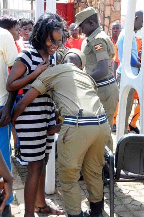 photo ugandan male police touching women in sensitive