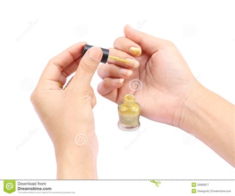 female hand with a golden nail polish on white background stock image image of brush finger