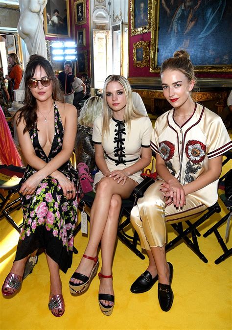 dakota johnson has a gorgeous sisters date shows plenty of cleavage in racy plunging dress