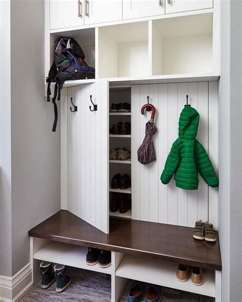 creative mudroom design features hidden shoe storage cabinets