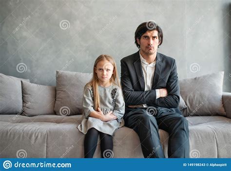father and daughter both annoyed and unhappy stock image