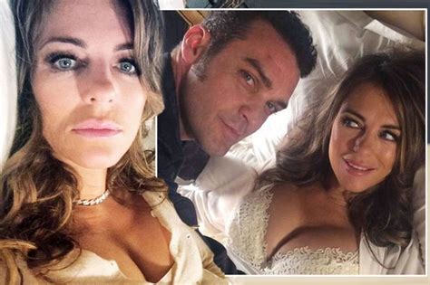 liz hurley flashes huge cleavage in sexy bed selfie as she