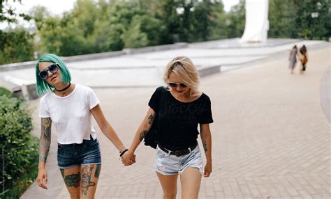 lesbian women walking on the street by alexey kuzma love lesbian