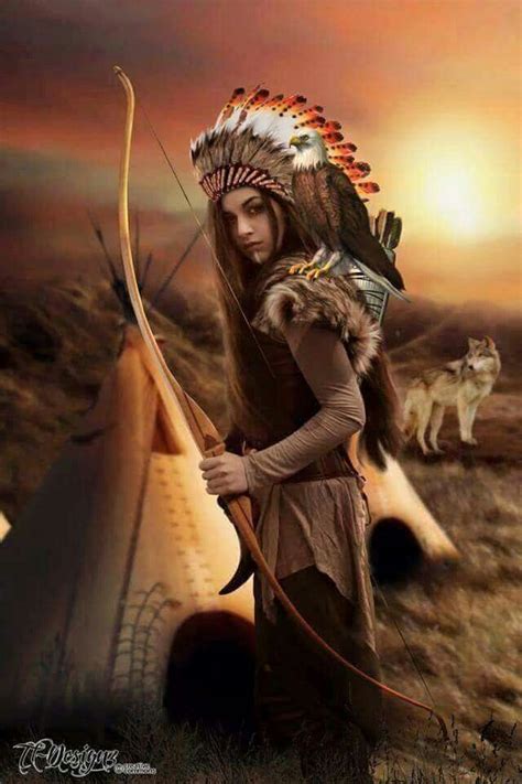 A Woman Dressed In Native American Clothing Holding A Bow And Arrow