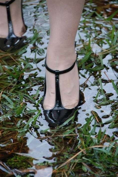 t bar heels in waterlogged grass elegant high heels heels muddy girl