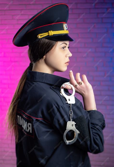 Premium Photo A Woman In A Russian Police Uniform With Handcuffs