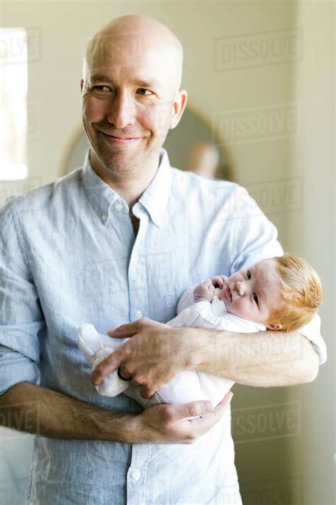 man holding  baby son stock photo dissolve