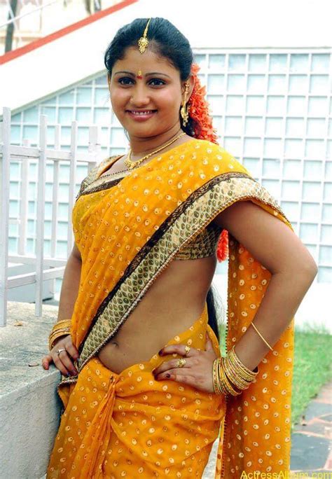 Cute Looking Actress Amrutha Valli Exposing Her Flat Belly And Hot