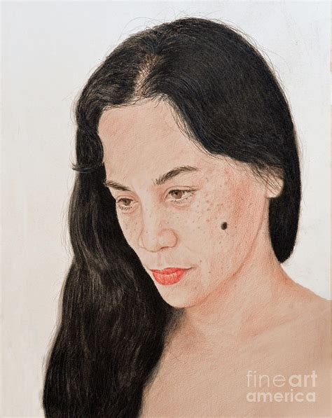 portrait of a long haired filipina beautfy with a mole on her cheek