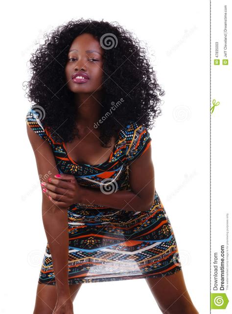 attactive skinny black teen girl standing in dress stock