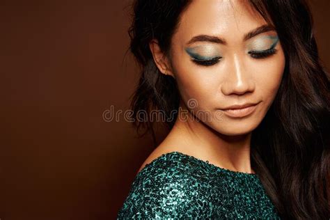 Close Up Portrait Of Beautiful Young Woman With Bright Makeup Of Eyes