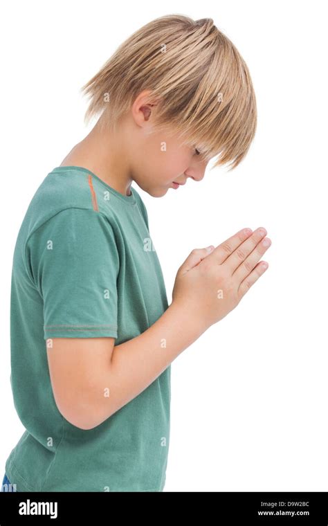 boy praying  bowed head stock photo alamy