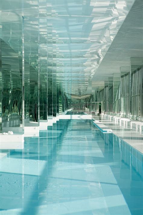 indoor swimming pool  clear walls  blue water