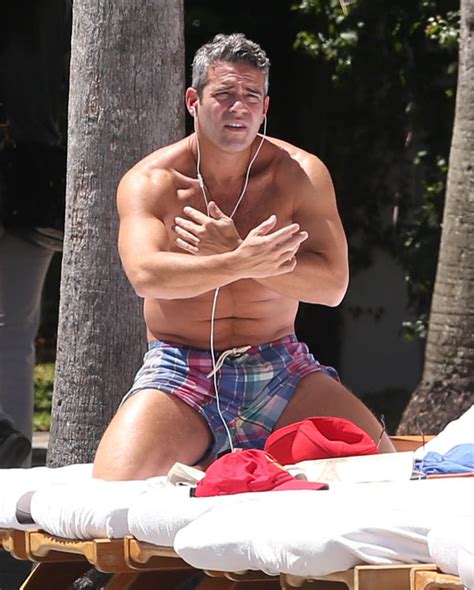 moobs in miami bravo s andy cohen caught shirtless at the swimming pool shows off bangin