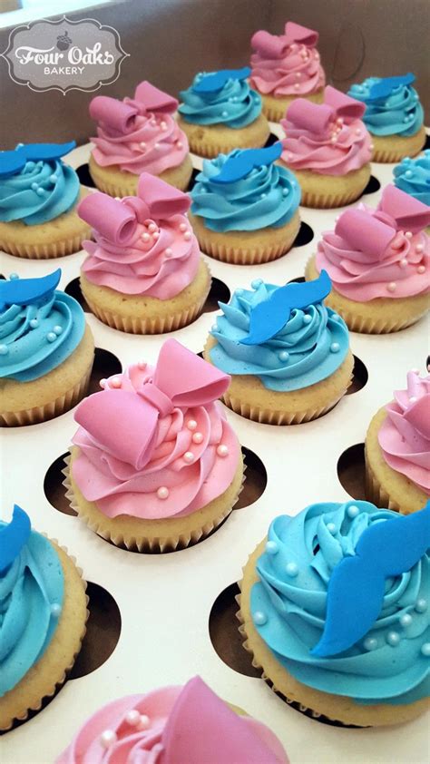 gender reveal cupcakes with bows and mustaches from four oaks bakery