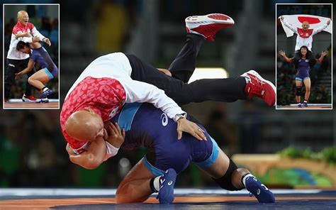 japanese wrestler celebrates winning gold  slamming coach   mat