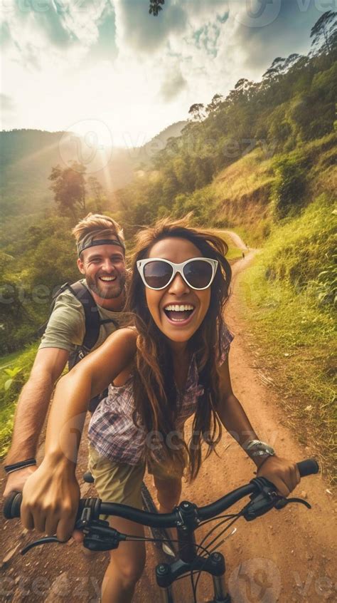 What A Beautiful Scenery Smiling Young Couple Riding On Bicycle While