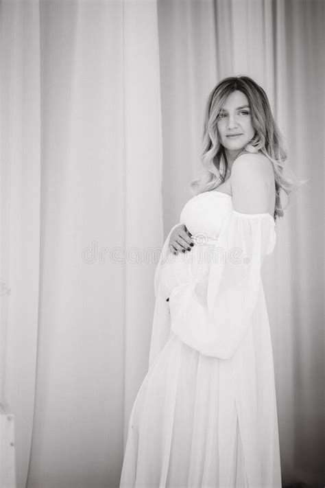 Beautiful Portrait Of Pregnant Woman In White Dress Concept Of Perfect