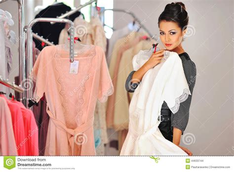 woman shopping  dress  clothing retail store stock photo image  clothing person