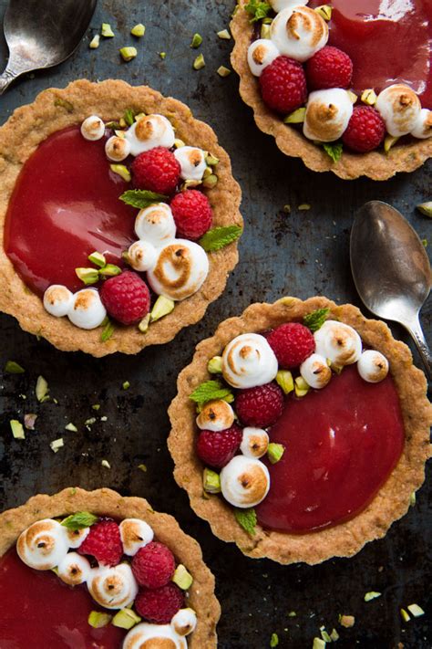 individual rhubarb tarts with pistachios berries
