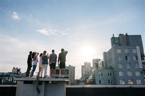 people standing  top  building  stock photo