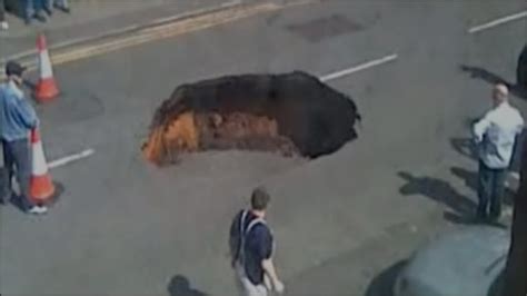 bbc news uk england manchester gaping hole appears in main road