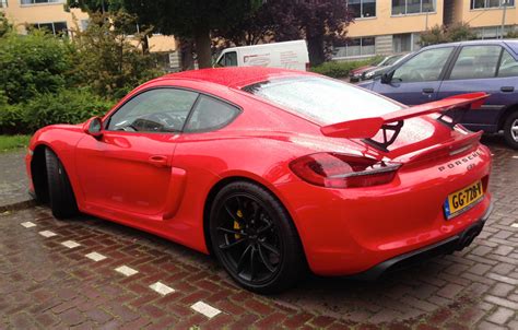 porsche cayman gt spotted  bright red