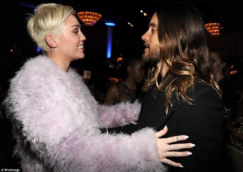 miley cyrus wraps up in lilac fur coat at the pre grammy clive davis