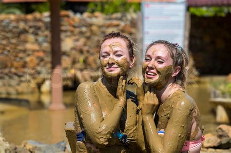 Young Girls Take Mud Baths To Improve The Condition Of The Skin And