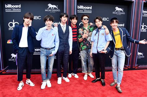 bts supported by army of fans beat kanye west and ariana grande as