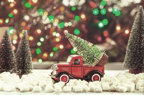 premium photo toy red car  christmas tree   roof