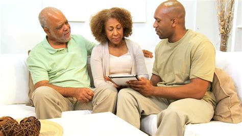 retired african american couple meeting independent financial advisor