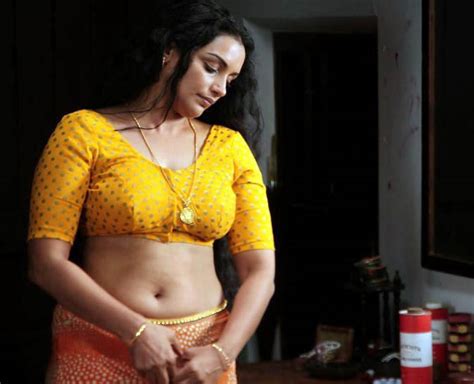 latest movies gallery swetha menon hot low cut yellow