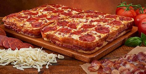 little caesars introduces pizza wrapped in 3 5 feet of bacon the