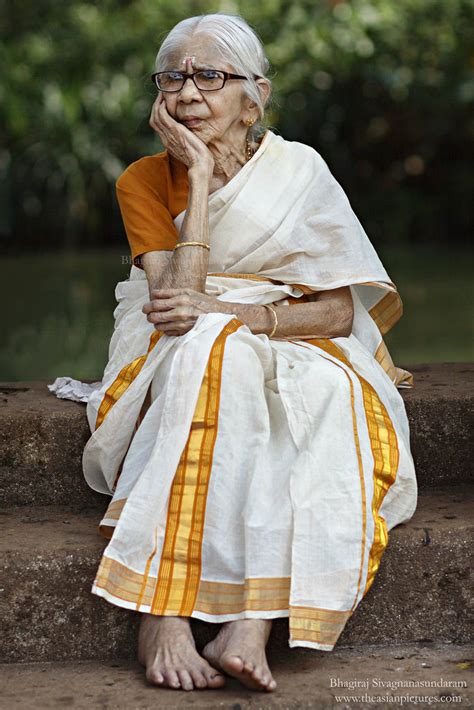 kerala old lady a kerala woman sitting near the pond at ma… flickr