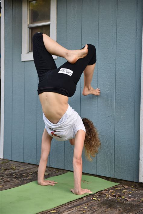 yoga scorpion handstand vrschikasana  courtney bell