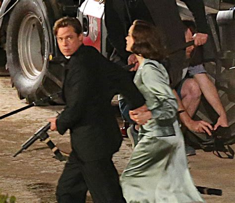 Brad Pitt And Marion Cotillard Hold Hands For A Scene On