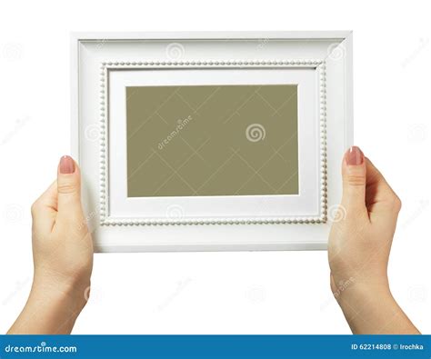 female hand holding  wooden frame isolated  white background stock
