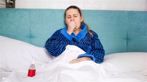 Portrait Of Young Woman Caught Cold Coughing In Bed Stock Image Image