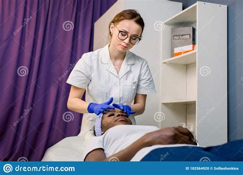 Young African American Female Getting A Facial Head Massage Pretty