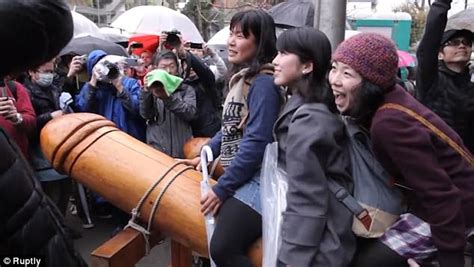crowds clamour to touch giant penis in japanese ceremony daily mail