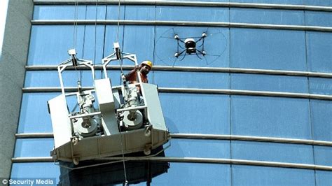 abu dhabi window cleaner rescued   drone daily mail
