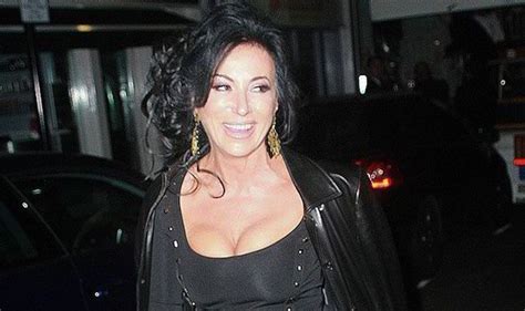 nancy dell olio flashes her cleavage in revealing figure hugging dress