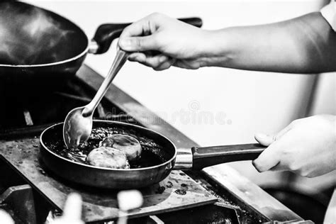 chef cooking   kitchen chef  work black white stock photo image  closeup eatery